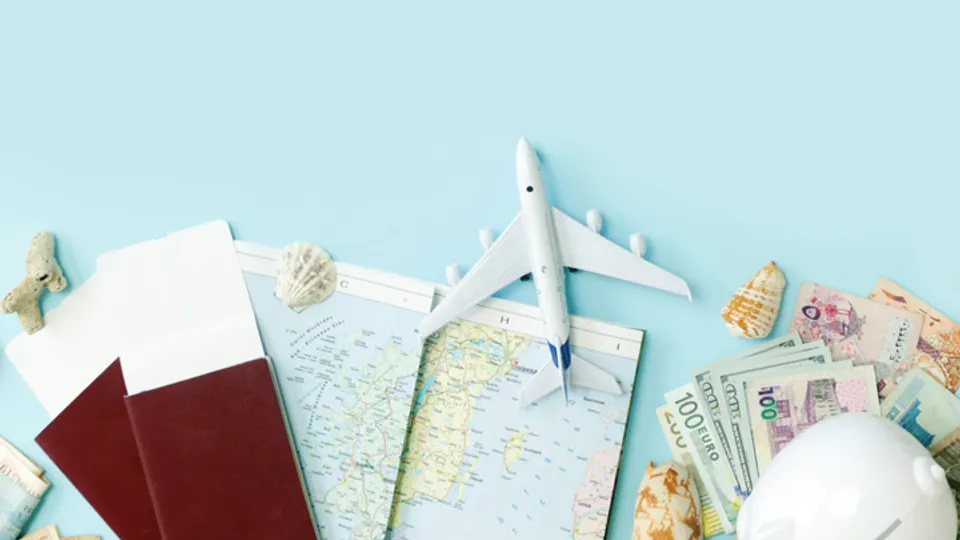Passports, maps, airplane model and currency representing international child relocation